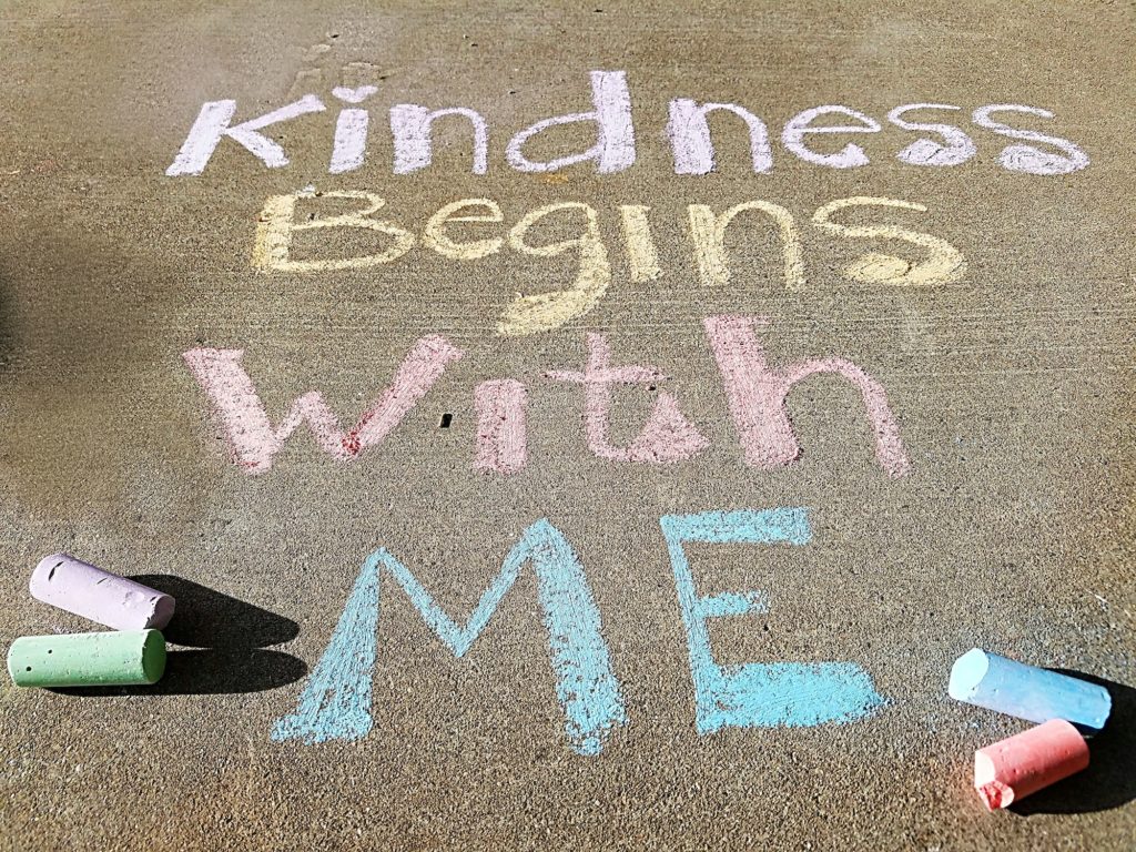 Kindness Matters-Inspirational message, Kindness Begins With Me, written in pastel chalk on sidewalk