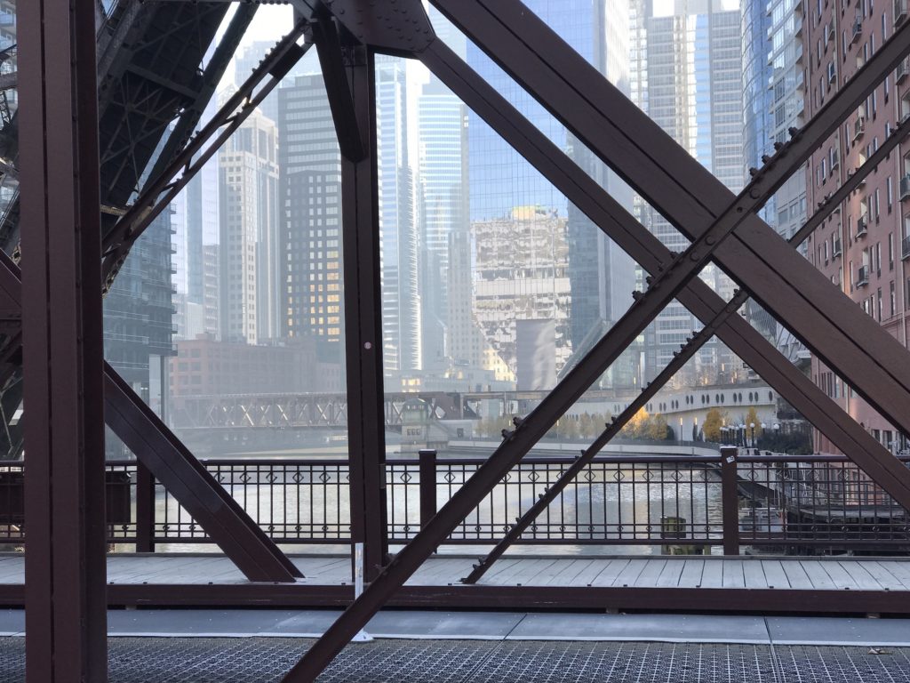 View of the city of Chicago through an old bridge